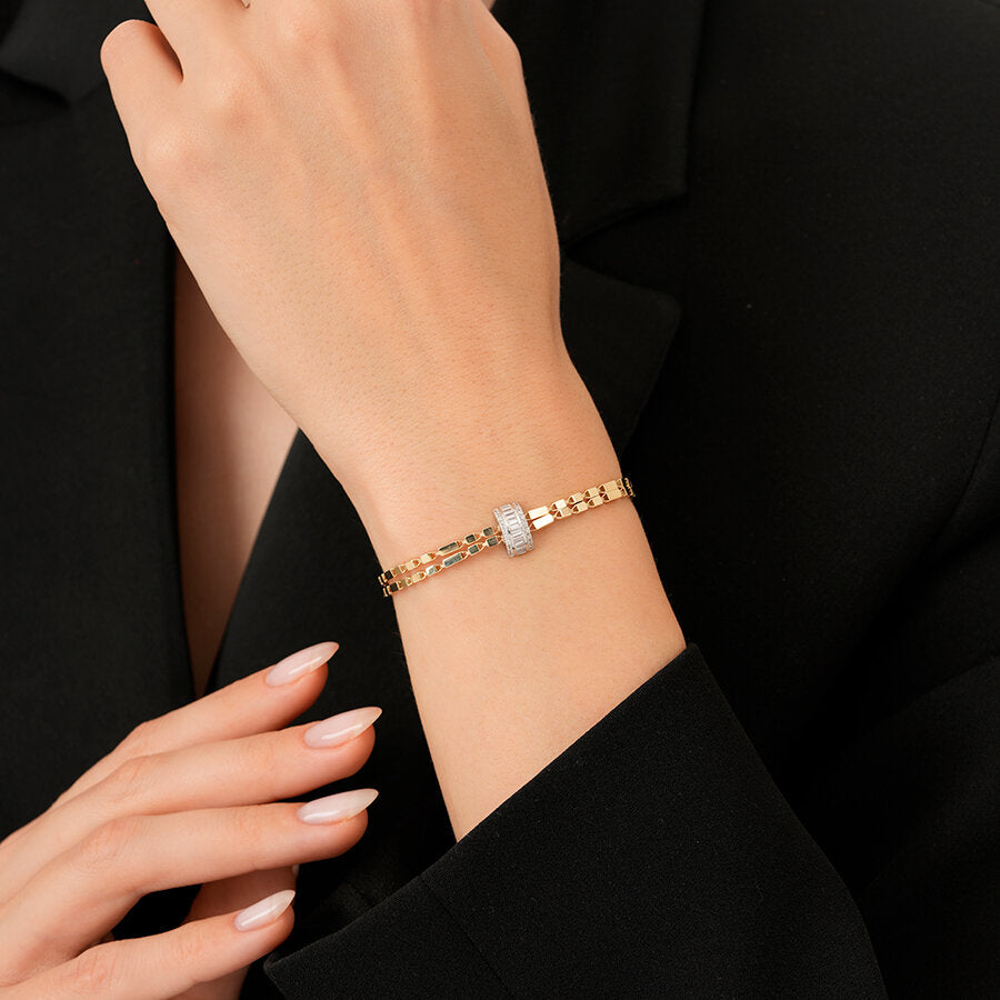 Armband mit Kette und Baguette-Steinen aus Gold