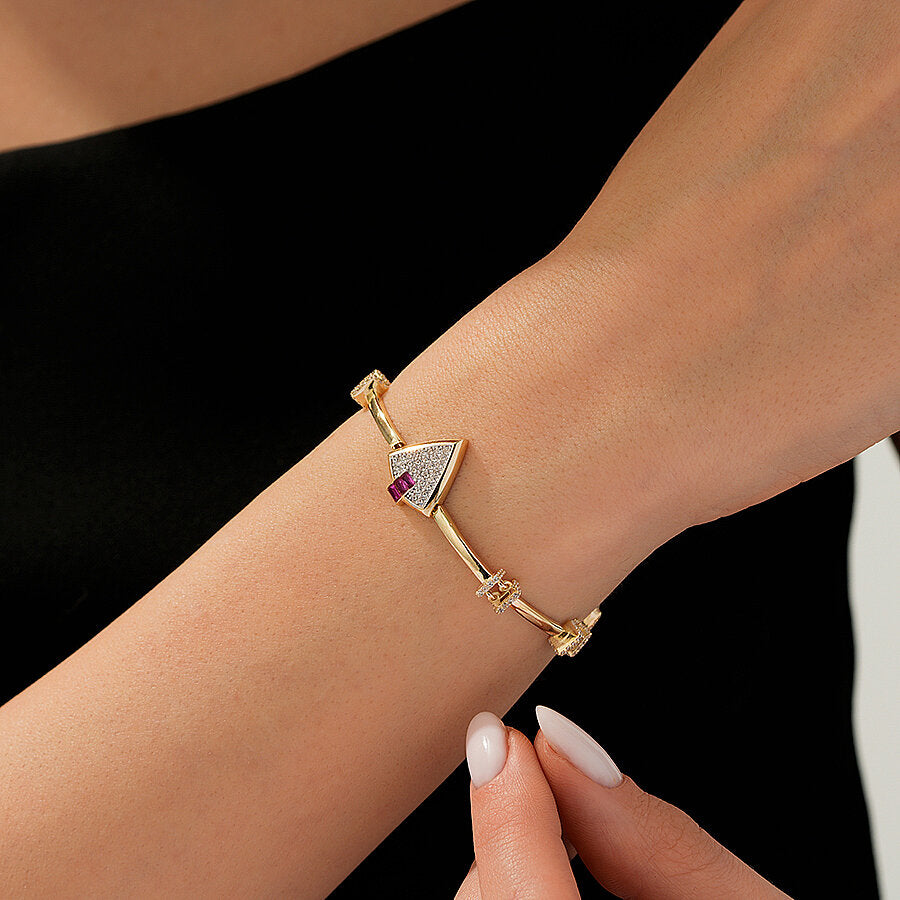 Trend-Armband mit fuchsienfarbenem dreieckigem Stein aus Gold