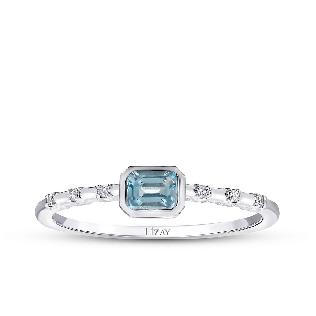 Ring mit 0,29 Karat Diamant und blauem Topas